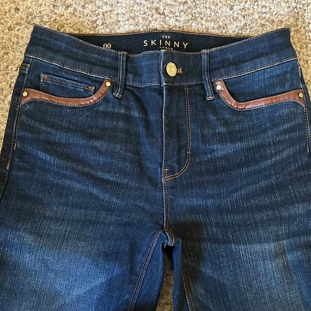 white house black market jeans with leather detail